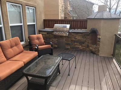 Composite Deck & Stone Patio  from Woodland Park Deck Builder